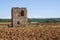 an ancient medieval ruin in a field, Tuscany
