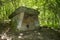 Ancient megalithic structure dolmen in the forest