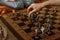 Ancient metal Roman Chess Set with silver and gold plated pieces on solid oak wood Board.