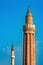 Ancient minarets with loudspeakers against the sky
