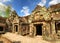 Ancient mossy buildings with carving of Preah Khan temple
