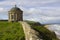 The ancient Mussenden Temple Monument on the clifftop edge overlooking Downhill Beach in County Londonderry Northern Ireland