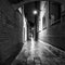 Ancient narrow streets and facades of old medieval buildings at night time close-up. Venice, Italy