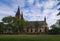 Ancient Neo Gothic Church of Saint Peter and Paul in Vysehrad `Upper Castle`. Summer landscape photo on a sunny morning.