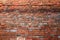 Ancient old red brick grunge wall fragment background, texture