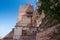 Ancient old tree and Jharokha, stone window projecting from the wall face of a building, in an upper story, overlooking Mehrangarh