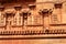 Ancient ornamental dravidian styled wall with sculptures in the Brihadisvara Temple in Thanjavur, india.