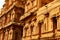 Ancient ornamental dravidian styled wall with windows of the Brihadisvara Temple in Thanjavur, india.