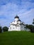 Ancient orthodox christian stone temple. Pskov, Russia. The Church of St. Basil the Great on the Hill on a background