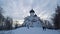 Ancient orthodox christian stone temple. Pskov, Russia. Church of St. Basil the Great on the Hill on cloudy sky background. Winter