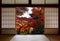 Ancient pagoda and beautiful red fall maples seen through a traditional Japanese doorway in autumn