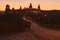 Ancient paving stone road with the bridge to the medieval Kamianets-Podilskyi castle. Autumn sunset landscape