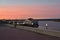 Ancient pier, deserted embankment, pink sunset. Naberezhnye Chelny. Russia.