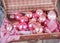 Ancient pink Christmas tree toys in antique suitcase