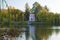 Ancient pink pavilion in autumn park