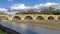 The ancient Ponte Buriano over the Arno river in the province of Arezzo, Tuscany, Italy, on a sunny day