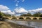 The ancient Ponte Buriano over the Arno river in the province of Arezzo, Tuscany, Italy, on a sunny day