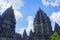 Ancient Prambanan Temple building with blue sky