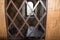 Ancient prison cell. View through a window with an iron grid