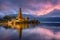 Ancient Pura Ulun Danu Bratan temple reflection with colorful sk