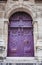 Ancient purple portal of the church of St. Stephen`s of the Moun