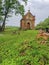 Ancient red brick crypt grave in an old cemetery