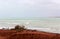 Ancient red rock formations at James Price Point, Broome, North Western Australia on a cloudy summer day.
