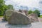 Ancient rocks once left by a glacier near a settlement