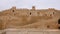 Ancient rocky walls defensive fortress Ribat in Monastir, Tunisia, crane shot