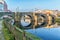 Ancient Roman bridge and reflections in the water in the town of Monforte de Lemos