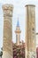 Ancient Roman columns framing a mosque\\\'s minaret in Al Mina archaeological site, Tyre, Lebanon