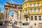 Ancient Roman triumphal arch or Golden Gate and square in Pula, Croatia, Europe