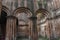 ancient ruin of bulding construction with eroded brick pillars and arch of the colonial landlords