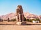 Ancient ruins of androsphinx statues near Hatshepsut temple, long view. High mountain on horizon. Photographed in Dayr