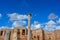 Ancient ruins of buildings from roman times. Ostia Antica in Italy, historic walls and columns with light blue sky, white clouds