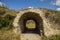 Ancient ruins of castle wall tunnel arch shape passage country side outdoor environment