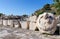 Ancient ruins of Eleusis, bust of Roman Emperor Marcus Aurelius in foreground, Attica, Greece