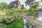 Ancient ruins and plants of wisteria in the Garden of Ninfa