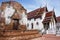 Ancient ruins ubosot ordination hall and antique old ruin stupa chedi for thai people visit respect praying blessing at Wat Yai