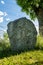 Ancient rune stone with a symbol of a red cross