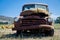 Ancient rusted truck in the farm field