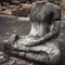 Ancient sandstone sculpture of Buddha. Ayutthaya, Thailand