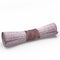 An ancient scroll of pink parchment, tied with a satin ribbon.