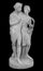 Ancient sculpture of Bacchus and Ariadne. Marble man and woman statue isolated on black background.
