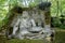 Ancient sculpture, Neptune, at the famous Parco dei Mostri, also called Sacro Bosco or Giardini di Bomarzo. Monsters