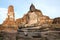 Ancient sculpture of the sitting Buda close up. Ruins of the Buddhist temple Wat Mahathat in Ayutthaya, Thailand