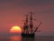 Ancient ship at sunset