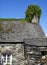 Ancient slated roofs, big and small, with windows.