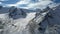 An ancient snow glacier among high mountains.