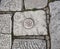 Ancient Solar symbol on old cobblestone